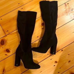 Tall black boots with a heel
